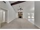 Spacious living room with stone fireplace, vaulted ceiling, and access to backyard at 4111 Sweet Water Ct, Conyers, GA 30094