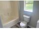 Cozy bathroom features a toilet and a shower tub combo at 6286 Cooper St, Douglasville, GA 30134