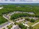 An aerial view of homes nestled among lush trees and manicured lawns at 74 Venture Path, Hiram, GA 30141