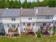 Aerial view of townhomes with decks, patios and lush greenery at 74 Venture Path, Hiram, GA 30141