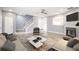 Cozy living room with modern furnishings, fireplace, and open staircase at 74 Venture Path, Hiram, GA 30141