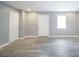 This room features plank flooring, natural light, neutral paint and white trim at 74 Venture Path, Hiram, GA 30141