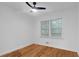 Bright bedroom with hardwood floors and a ceiling fan at 1386 Sandy Ln, Decatur, GA 30032