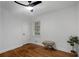 Bright bedroom with hardwood floors, bench, and a ceiling fan at 1386 Sandy Ln, Decatur, GA 30032