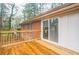 Inviting deck with wood floors and sliding glass doors to let the outside in and overlook the yard at 1386 Sandy Ln, Decatur, GA 30032