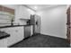 Bright kitchen with granite countertops, stainless steel appliances, and modern fixtures at 1386 Sandy Ln, Decatur, GA 30032
