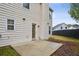 Backyard featuring a patio and a door leading to the house, with a partially visible lawn at 2828 Marksman Trl, Austell, GA 30106
