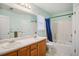 Updated bathroom with double sink vanity, tub shower, and toilet, perfect for Gathering living at 2828 Marksman Trl, Austell, GA 30106