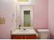 Powder room includes a pedestal sink, mirror, toilet, and neutral walls for a simple, functional space at 2828 Marksman Trl, Austell, GA 30106