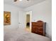 The bedroom features a dresser, an ornate accent painting, and a view into a connecting room at 2828 Marksman Trl, Austell, GA 30106