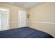 Bedroom showcasing natural lighting, neutral paint, with a door leading to another room at 2828 Marksman Trl, Austell, GA 30106