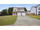 Charming two-story home with a two-car garage, stone accents and a well-manicured front yard at 2828 Marksman Trl, Austell, GA 30106