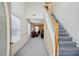 View of the front entry featuring stairs, high ceiling, and access to the living room at 2828 Marksman Trl, Austell, GA 30106