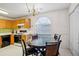 Cozy eat-in kitchen featuring modern appliances, wooden cabinets, and a breakfast table at 2828 Marksman Trl, Austell, GA 30106