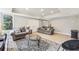 Cozy basement area featuring tile flooring, neutral walls, and comfortable seating at 3887 Hickory Manor Dr, Suwanee, GA 30024