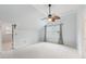 Bedroom with natural light, ceiling fan, and neutral carpet, creating a cozy and relaxing atmosphere at 3887 Hickory Manor Dr, Suwanee, GA 30024