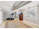 Spacious bonus room with trey ceilings, ceiling fan, and windows at 3887 Hickory Manor Dr, Suwanee, GA 30024