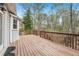 Wood deck offers an outdoor space with wooded views from the back of the home at 3887 Hickory Manor Dr, Suwanee, GA 30024