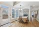 Cozy dining area with natural light offering view into the living area and the outside deck at 3887 Hickory Manor Dr, Suwanee, GA 30024