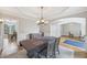 Elegant dining room with hardwood floors, chandelier lighting, and neutral tones at 3887 Hickory Manor Dr, Suwanee, GA 30024