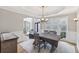 Traditional dining room with hardwood floors, natural light and neutral tones at 3887 Hickory Manor Dr, Suwanee, GA 30024