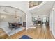Open concept dining room with hardwood floors, natural light, and staircase at 3887 Hickory Manor Dr, Suwanee, GA 30024