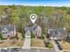 Well-maintained two-story home featuring brick accents, mature trees, and a two-car garage at 3887 Hickory Manor Dr, Suwanee, GA 30024