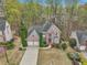 Beautiful two-story home featuring lush landscaping, a spacious lawn, and a two-car garage at 3887 Hickory Manor Dr, Suwanee, GA 30024