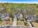 Well-maintained two-story home featuring brick accents, mature trees, and a two-car garage at 3887 Hickory Manor Dr, Suwanee, GA 30024