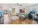 Spacious living room with hardwood floors, neutral tones, and modern furnishings at 3887 Hickory Manor Dr, Suwanee, GA 30024