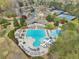 Aerial view of the community pool and clubhouse including a water slide and splash pad at 3887 Hickory Manor Dr, Suwanee, GA 30024