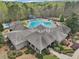 Aerial shot showcasing the community pool, splash pad, and the clubhouse at 3887 Hickory Manor Dr, Suwanee, GA 30024