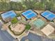 Community amenities including four tennis courts, playground, sand volleyball court, and ample parking at 3887 Hickory Manor Dr, Suwanee, GA 30024