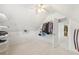 Walk-in closet providing ample storage with installed shelving and clothing racks for organization at 3887 Hickory Manor Dr, Suwanee, GA 30024