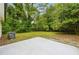 Large backyard with green grass and a cement patio at 1382 Elizabeth Ln, Atlanta, GA 30344