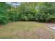 Large backyard featuring lush greenery and privacy, perfect for outdoor entertaining and recreation at 1382 Elizabeth Ln, Atlanta, GA 30344