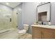 Beautiful bathroom with marble floors, shower, toilet, granite vanity, and modern finishes at 1382 Elizabeth Ln, Atlanta, GA 30344