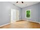 Bedroom with light-filled window and entrance to closet and bathroom at 1382 Elizabeth Ln, Atlanta, GA 30344