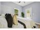 Comfortable bedroom with natural light, modern decor, and an exterior door at 1382 Elizabeth Ln, Atlanta, GA 30344