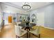 Open-concept dining room with hardwood floors, ample lighting, and access to the living room for easy entertaining at 1382 Elizabeth Ln, Atlanta, GA 30344