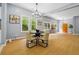 Spacious dining room boasts modern lighting, large windows, and hardwood floors, perfect for entertaining guests at 1382 Elizabeth Ln, Atlanta, GA 30344