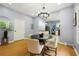 Bright dining room featuring updated light fixture, and access to kitchen at 1382 Elizabeth Ln, Atlanta, GA 30344