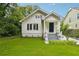 Charming home featuring a well-maintained lawn and welcoming entrance at 1382 Elizabeth Ln, Atlanta, GA 30344