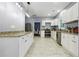 Modern kitchen featuring stainless steel appliances, granite countertops, and ample storage space in white cabinetry at 1382 Elizabeth Ln, Atlanta, GA 30344