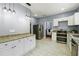 Well-equipped kitchen with stainless steel appliances, stone countertops, and modern lighting, perfect for culinary enthusiasts at 1382 Elizabeth Ln, Atlanta, GA 30344