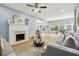 Living room featuring hardwood floors, open layout, and an inviting fireplace at 1382 Elizabeth Ln, Atlanta, GA 30344
