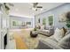 Spacious living room featuring a fireplace, hardwood floors, and a large window at 1382 Elizabeth Ln, Atlanta, GA 30344