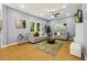 Inviting living room boasts hardwood floors, neutral walls, ceiling fan, and natural light at 1382 Elizabeth Ln, Atlanta, GA 30344