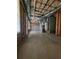 Unfinished basement reveals utilities and structural elements, offering customization potential at 1535 Wilkes Crest Dr, Dacula, GA 30019