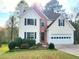 Charming two-story home with attached garage and well-manicured front lawn at 1535 Wilkes Crest Dr, Dacula, GA 30019